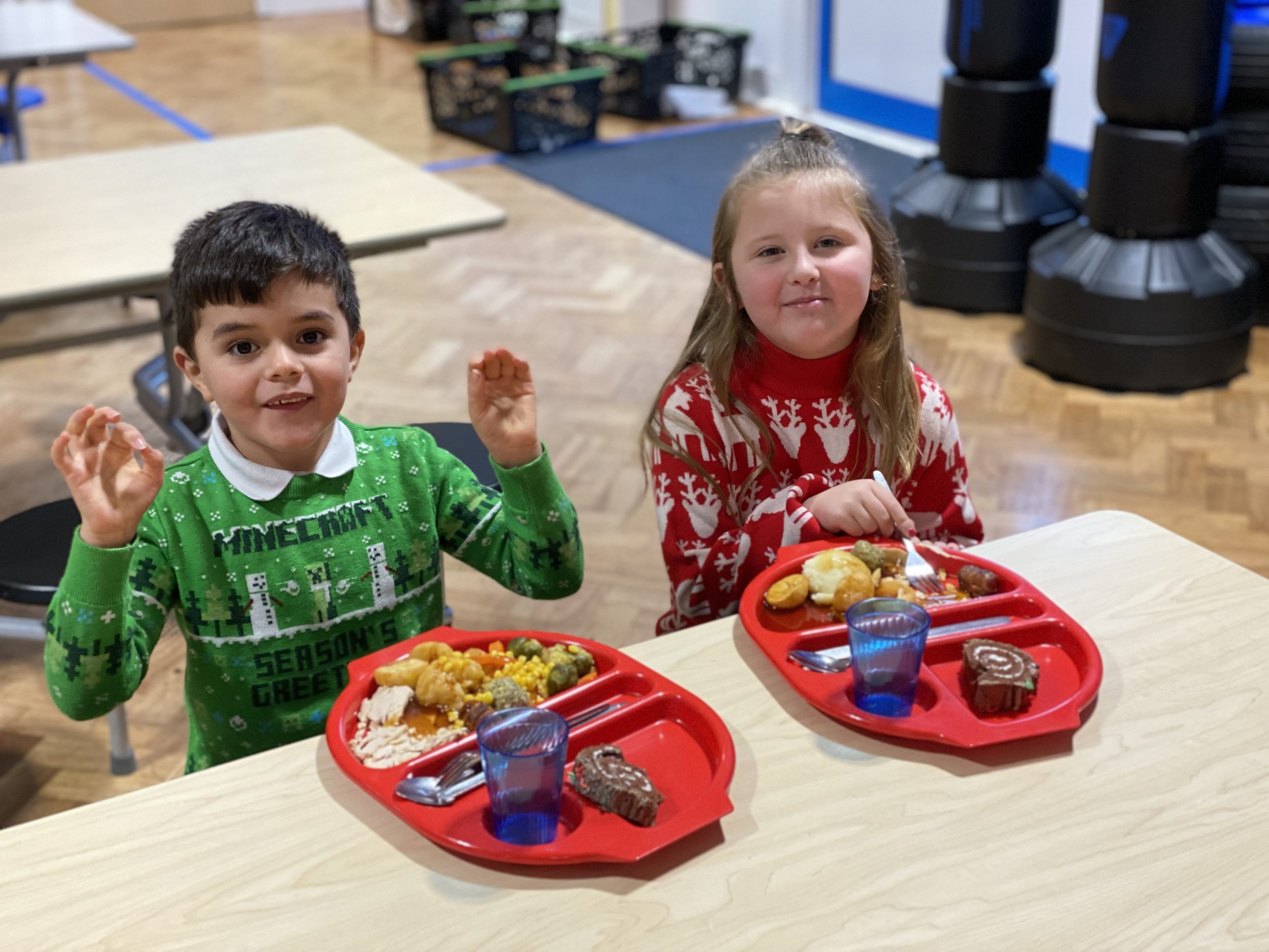 KS1 children enjoying their Christmas dinner