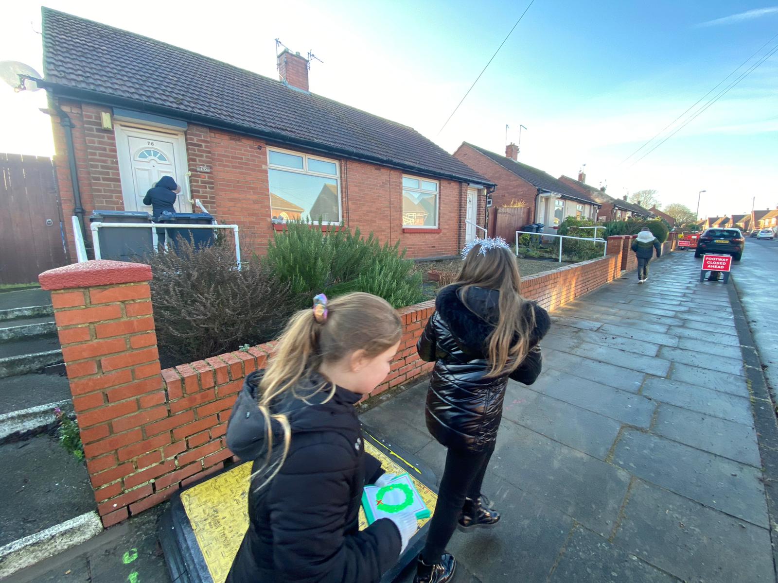 Year 6 children delivering cards made by pupils to our local residents