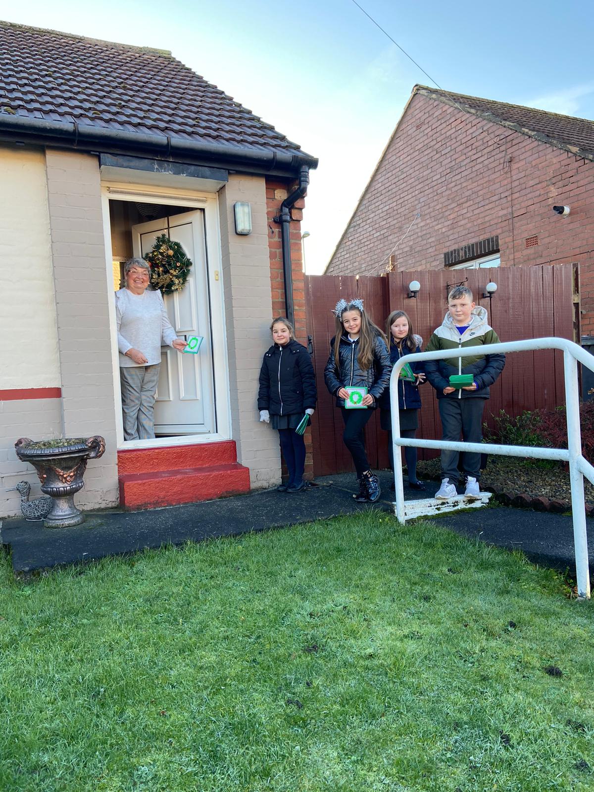 Year 6 children delivering cards made by pupils to our local residents