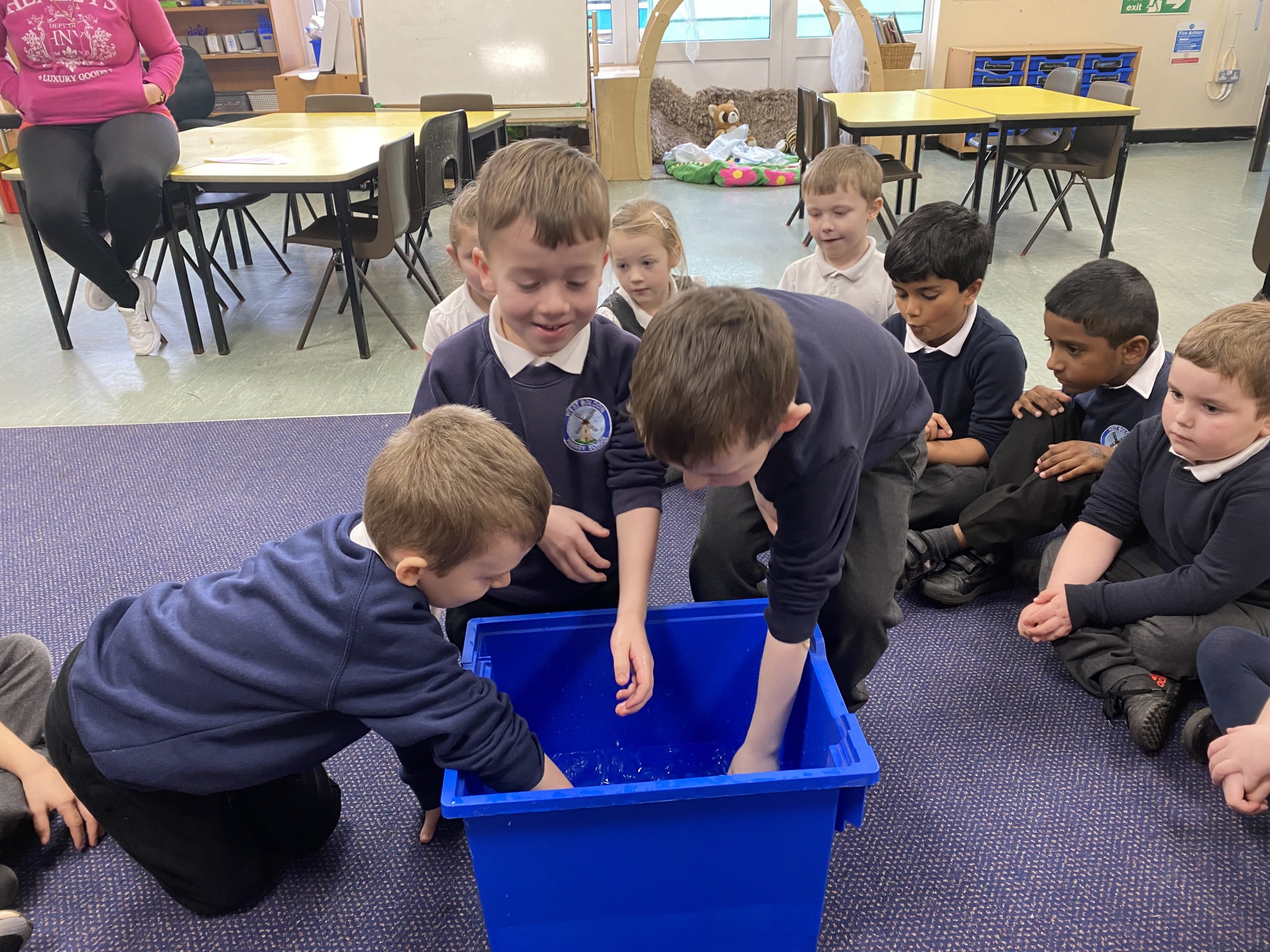 Year 1 children investigating how blubber works