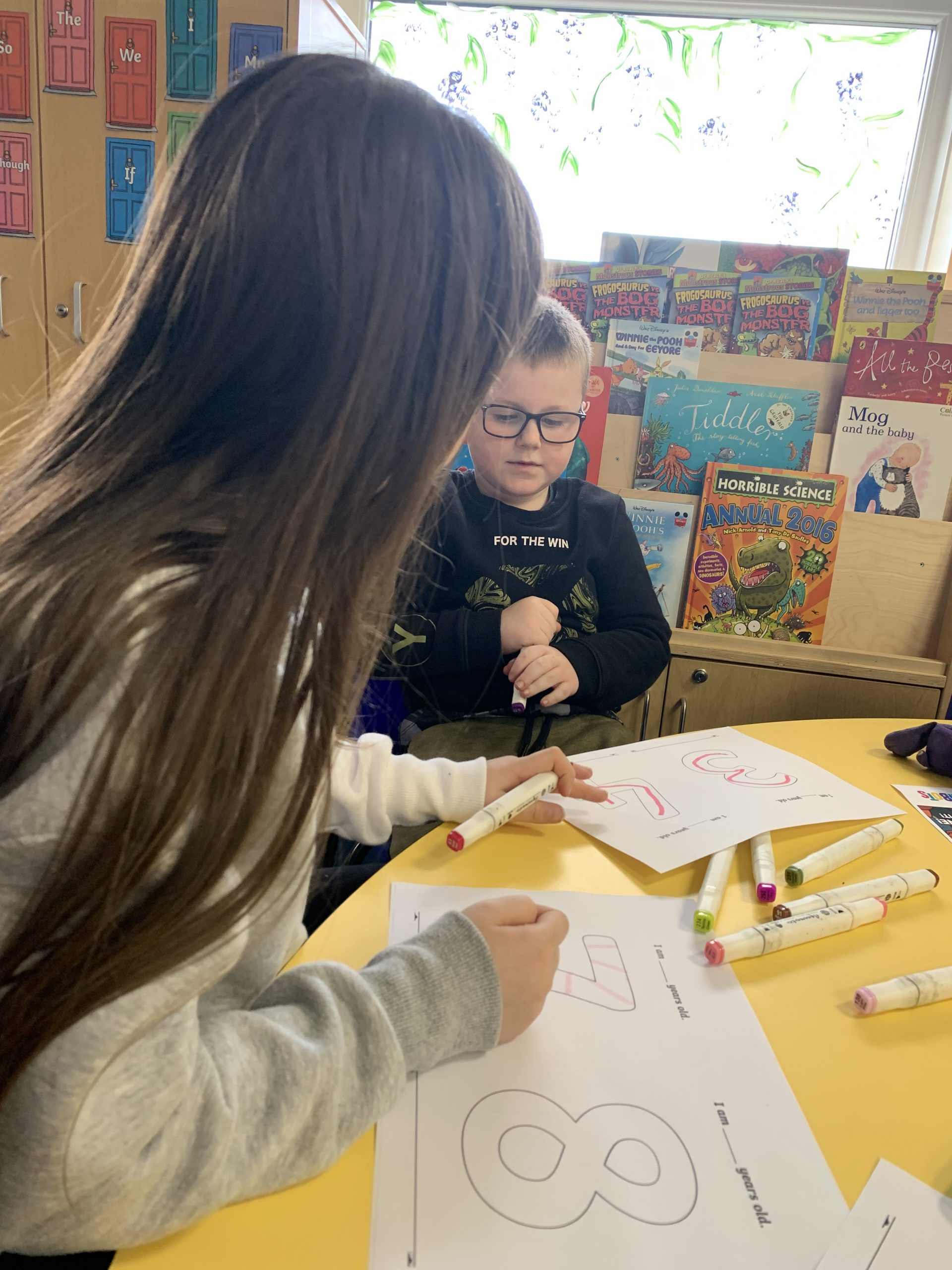 Year 2 children solving maths problems for number day