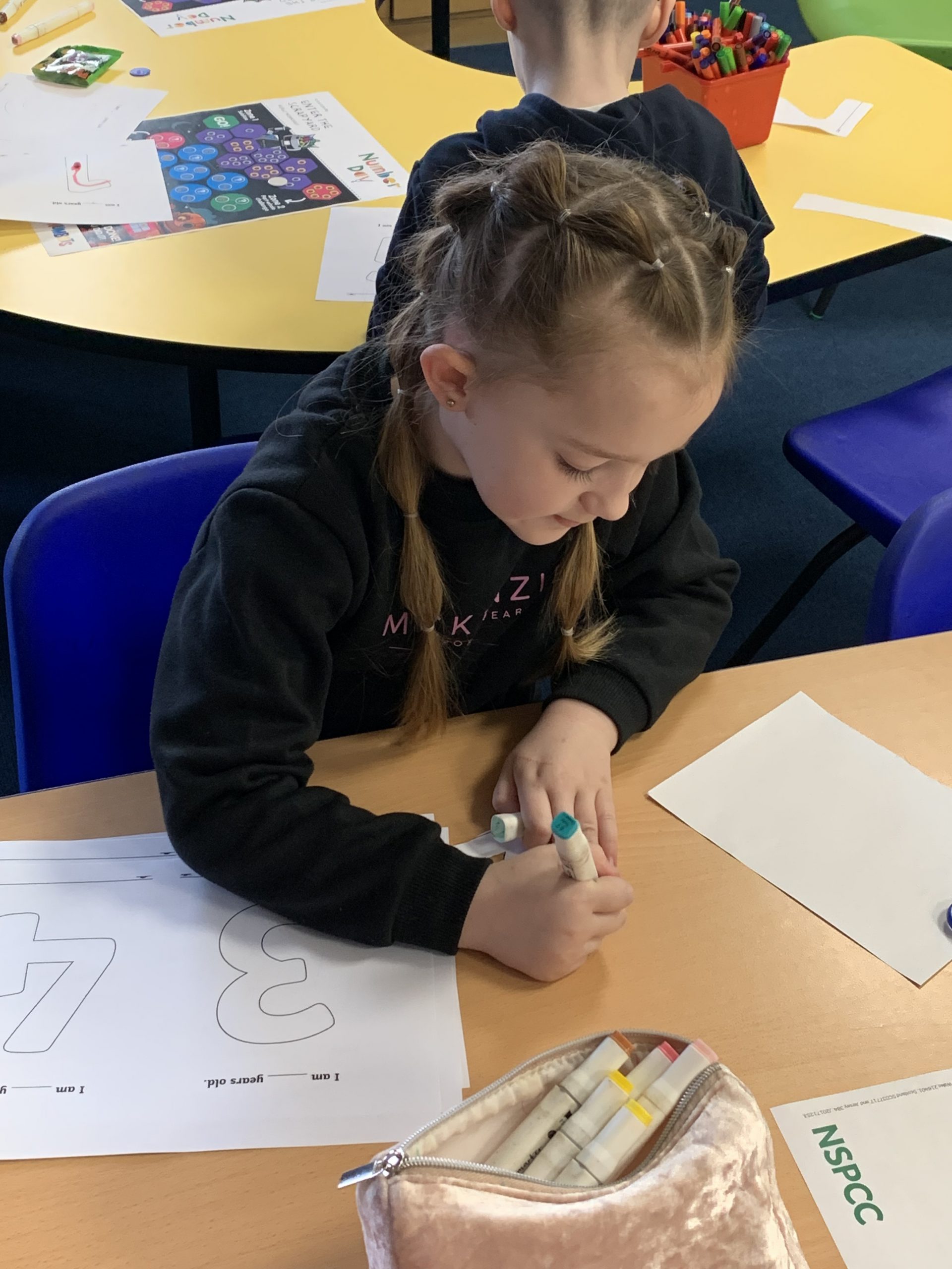 Year 2 children solving maths problems for number day