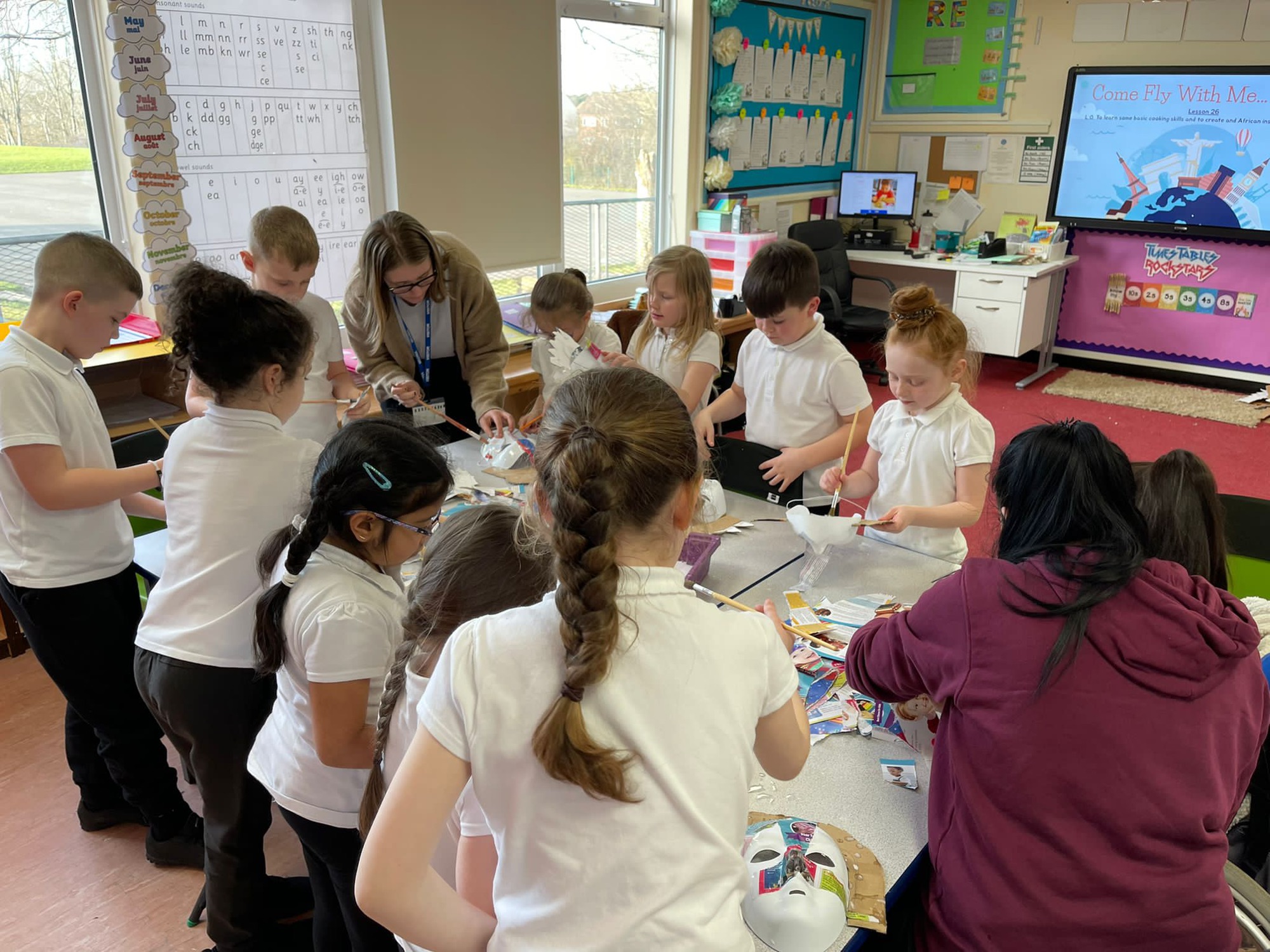 Year 3 children making their masks