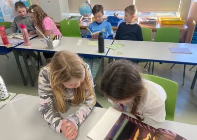 Year 4 children reading books to each other