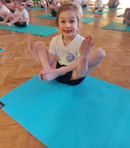Year 1 children taking part in their yoga session
