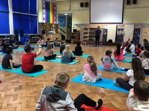 Year 5 children taking part in their yoga session