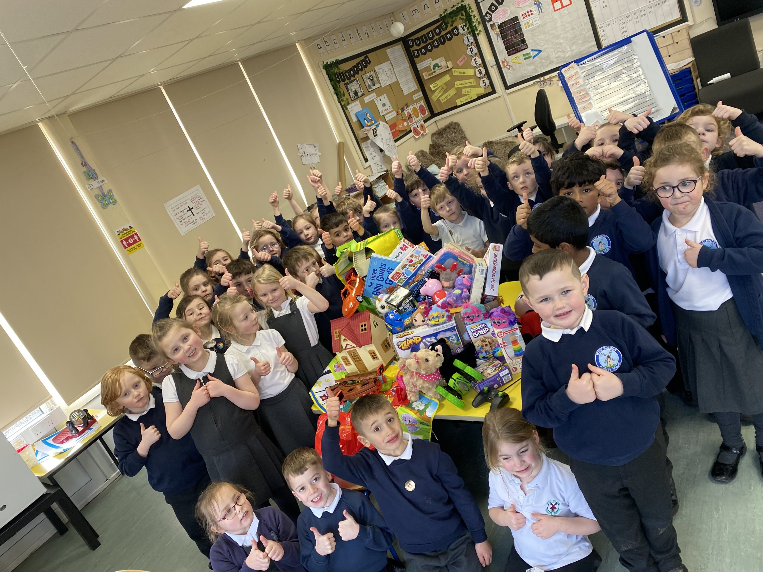 Year 1 children with their donations for Barnardos