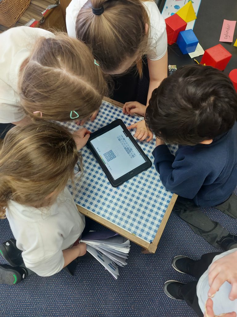 Year 1 children playing Wordle on the iPads