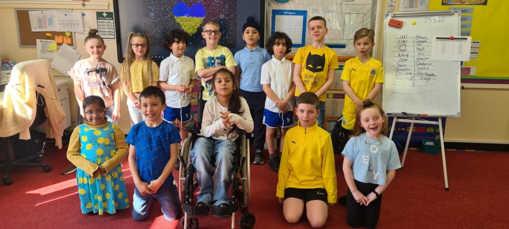 Year 3 children wearing yellow and blue for Ukraine