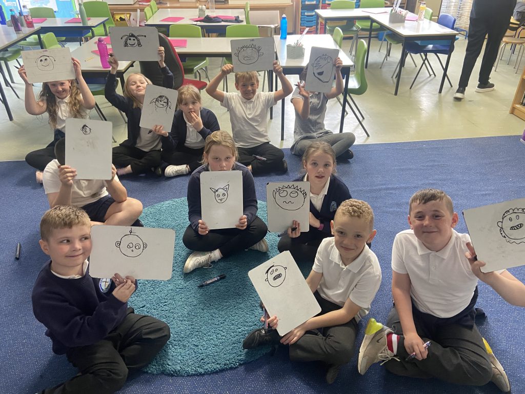 Year 4 children drawing their aliens