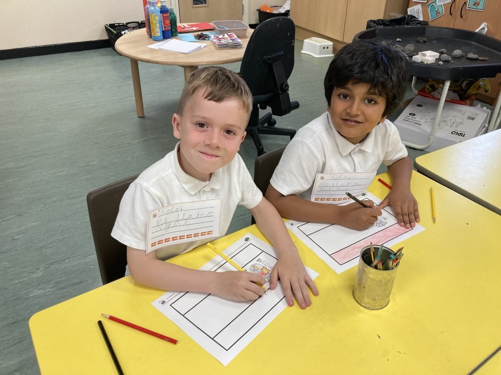 Year 1 children making spanish flags in Spanish Club