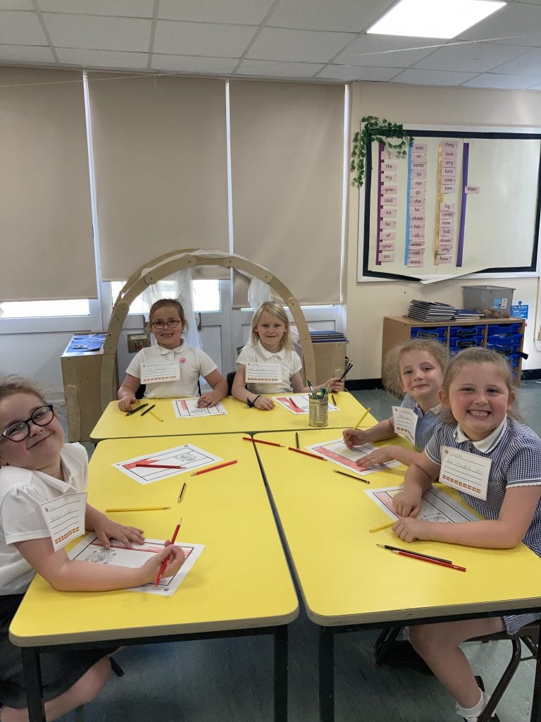 Year 1 children making spanish flags in Spanish Club