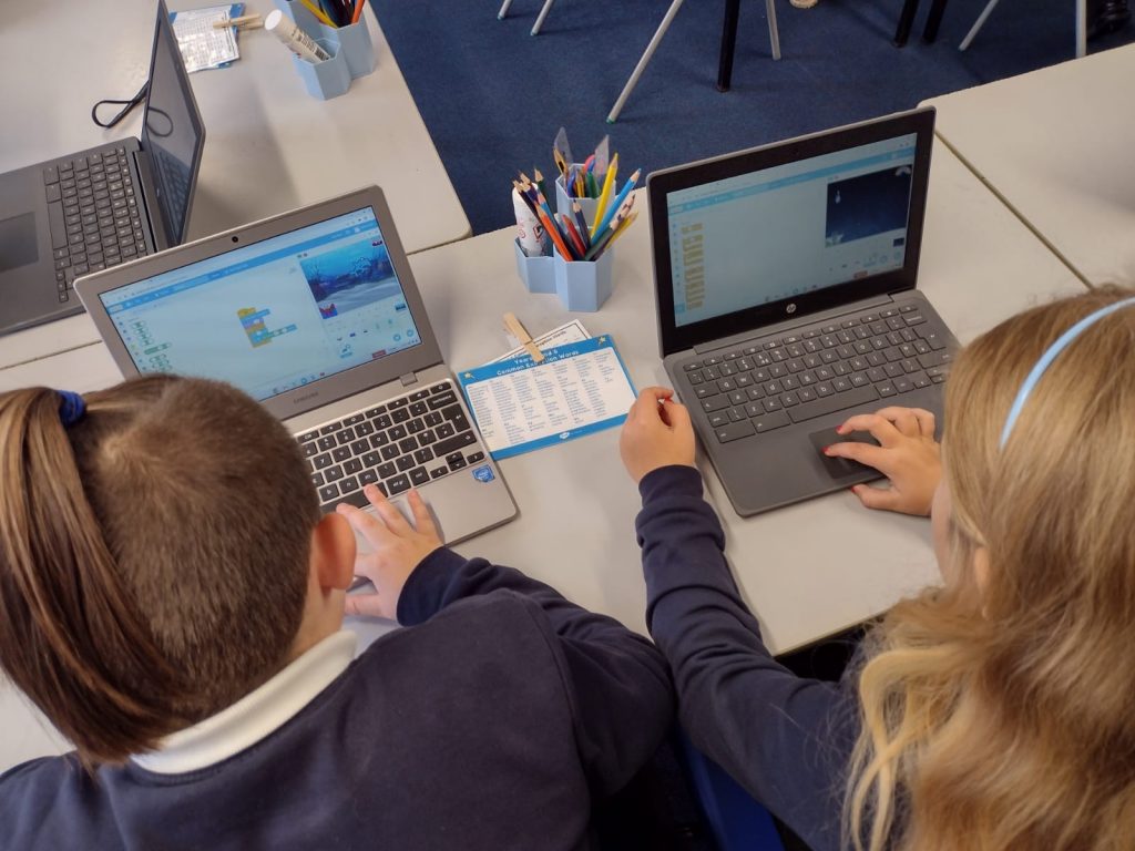 Year 5 working hard on their coding with Open Zone staff