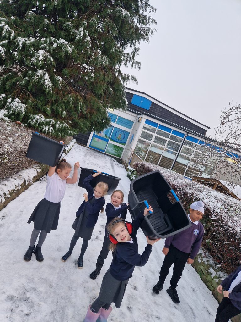 Eco council delivering paper bins to each class