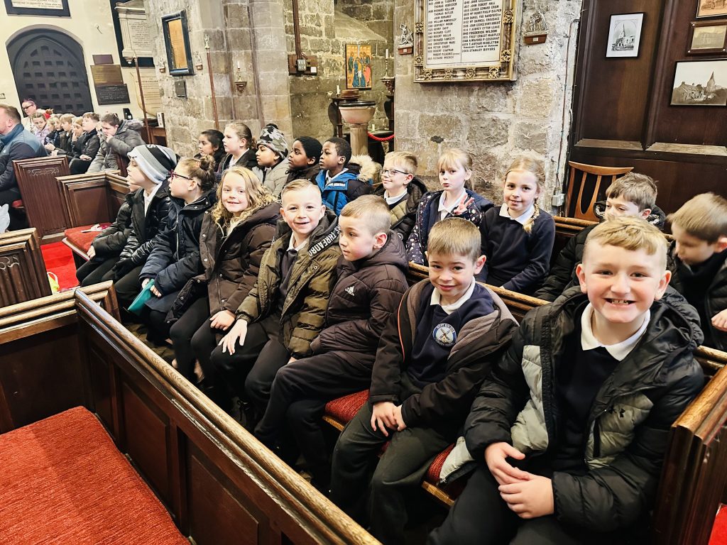 KS2 children enjoying their visit to St Nicholas Church